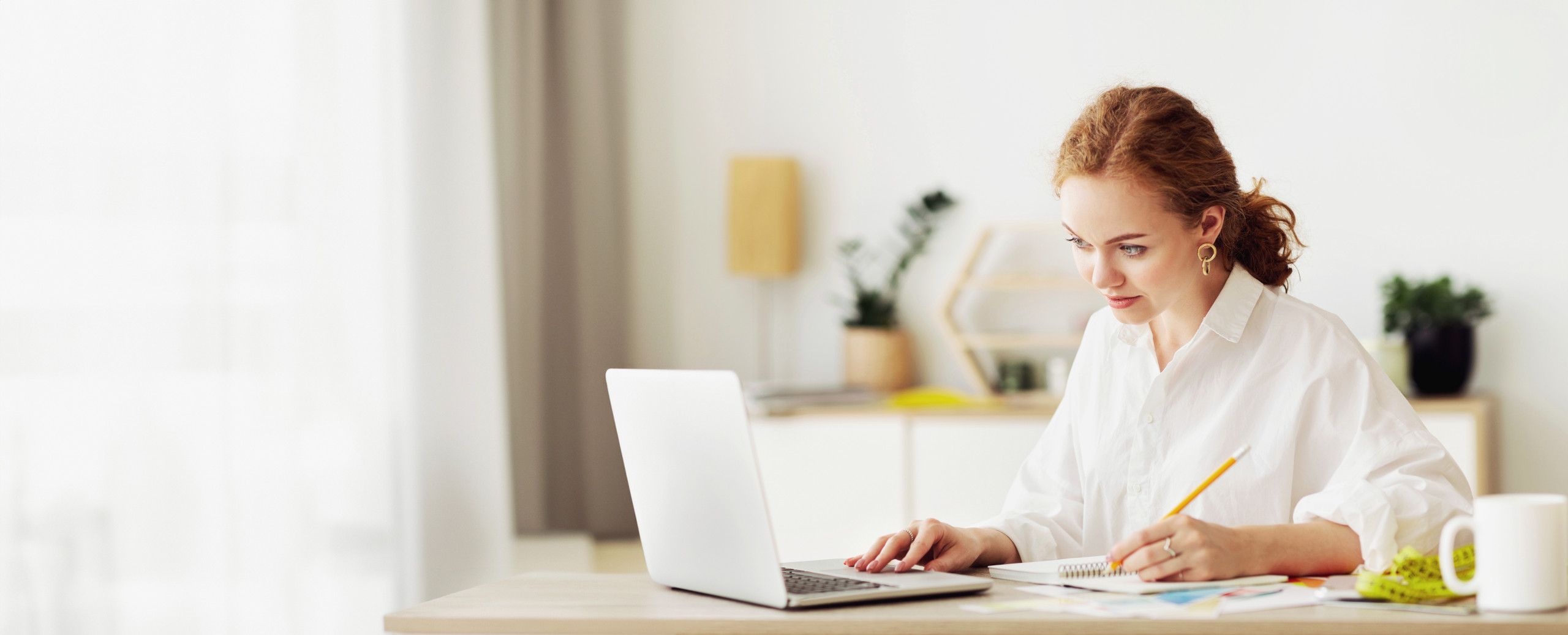 Professional working on a laptop at a bright office desk, illustrating preparation of Vietnamese documents for apostille and use abroad