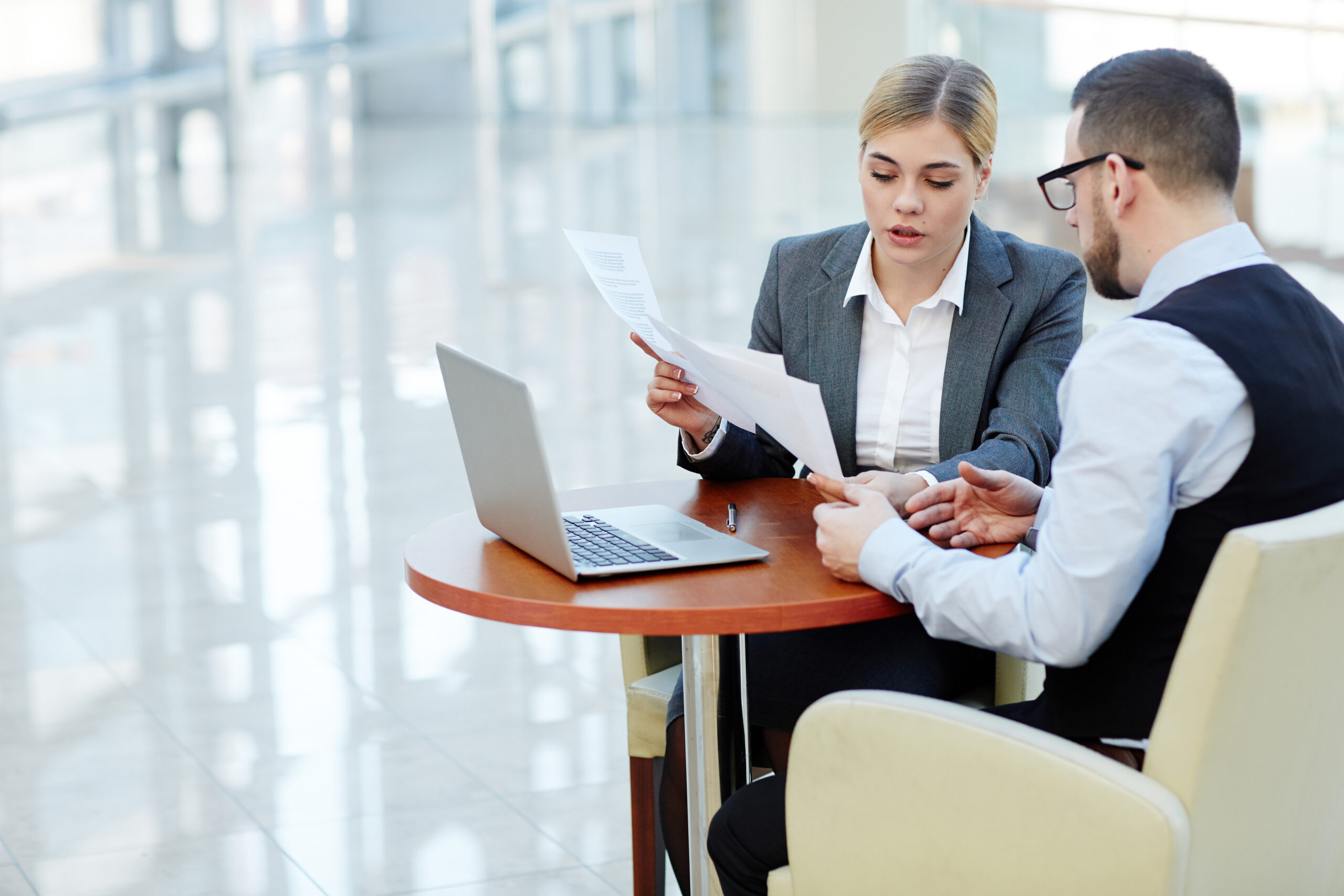 Businesswoman reviewing a contract, representing HR compliance for training companies and foreign employers in Vietnam