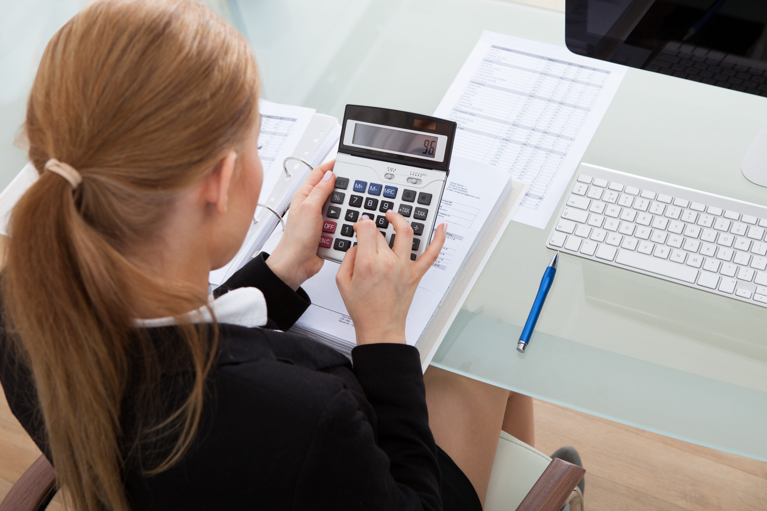 Businesswoman working at her desk, representing company setup in Vietnam for foreign investors
