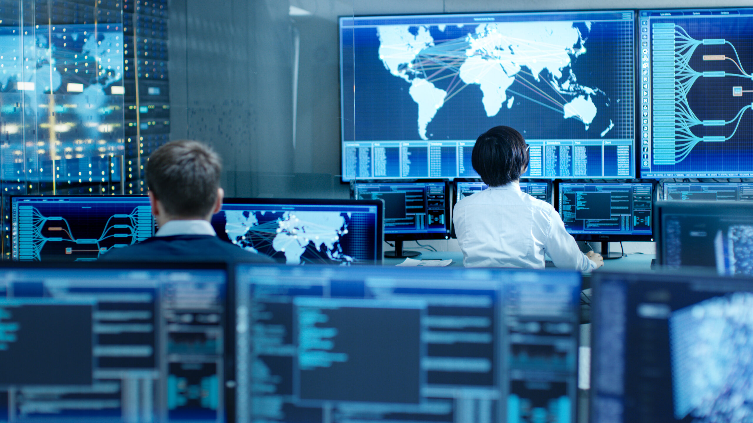Operators monitoring systems in a control room, illustrating post-licensing operational compliance for factories in Vietnam